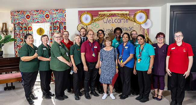 https://www.apollohealthco.com/wp-content/uploads/LindenHouseVisitEmployees.jpg